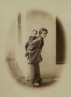 Images Dated 4th August 2011: Young Japanese woman with a child