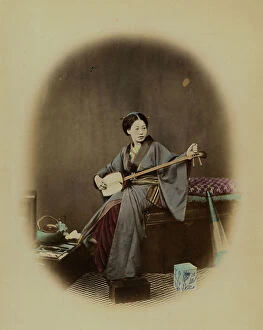 Japan: Young Japanese woman with a musical instrument