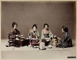 Japan: Young Japanese women have lunch with bowls of rice