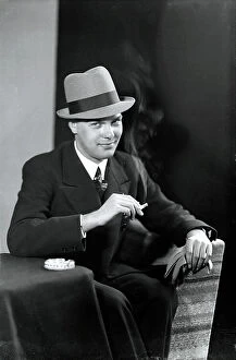 Images Dated 28th November 2008: Young man in a hat with cigarette