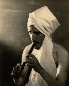 Images Dated 14th October 2009: Young man with a turban playing the flute