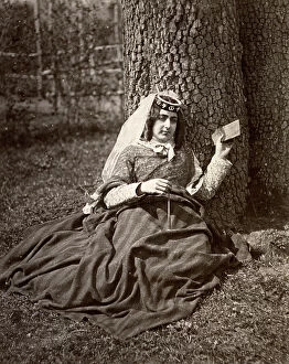 Images Dated 16th May 2011: Young Russian woman of the Caucasus shown seated at the foot of a tree
