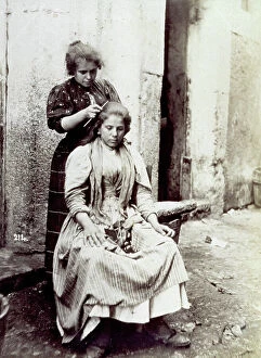 Images Dated 9th October 2008: Young woman shown having her long hair dressed by a hairdresser