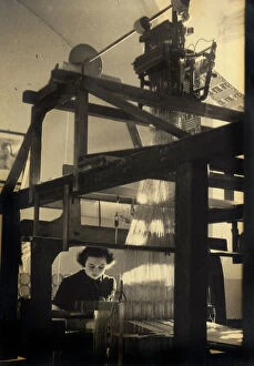 Images Dated 26th May 2011: Young woman working at a loom in a workshop. Postcard sent by the author to Vincenzo Balocchi
