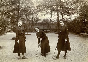 Images Dated 14th April 2010: Three young women portrayed as playing cricket in the courtyard of a school
